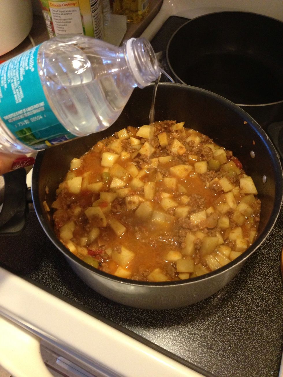 Add water, cover and let it simmer...
