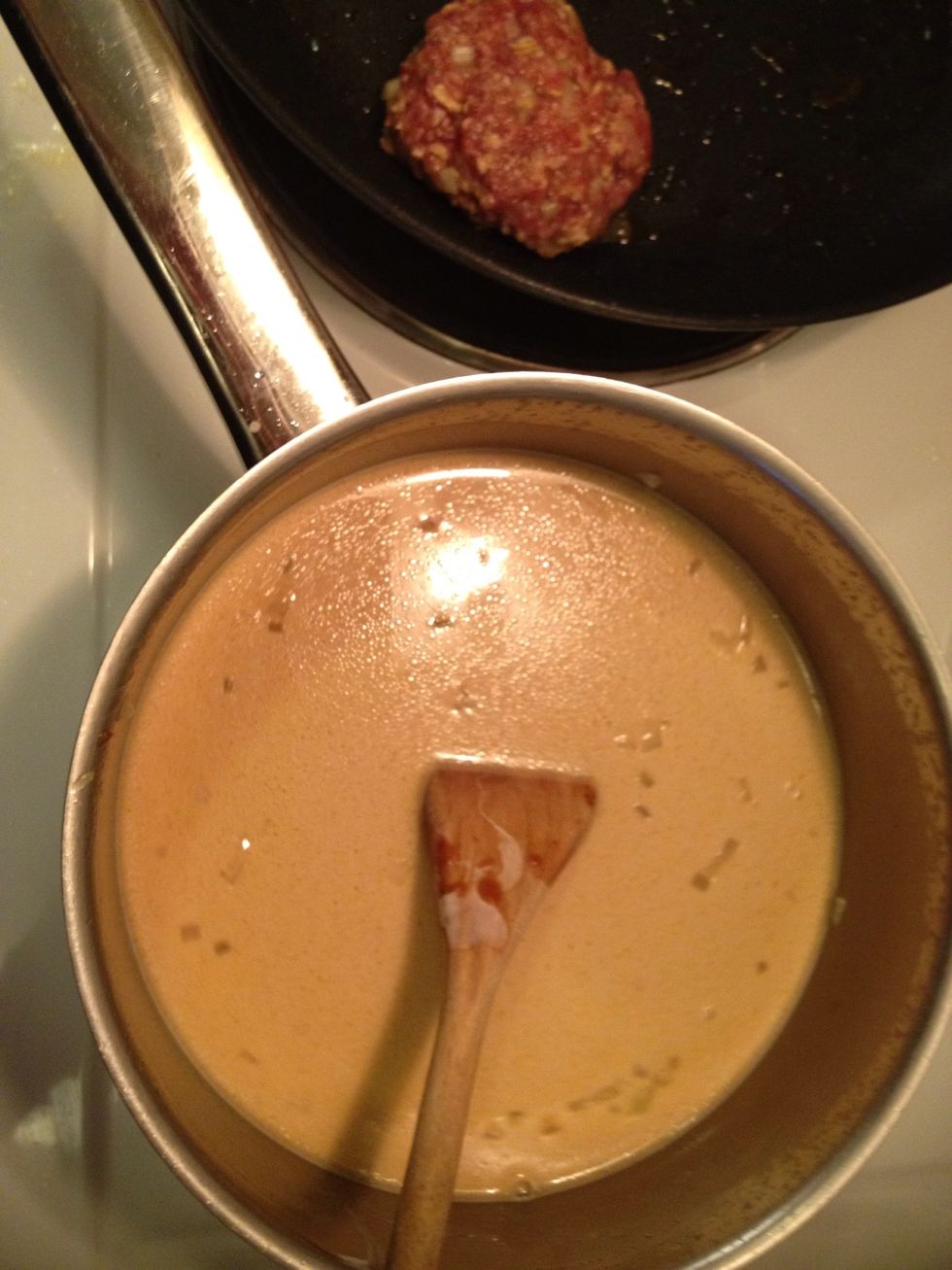 Add water, cream, the reduced beef stock, the Green pepper, soy & and the spices