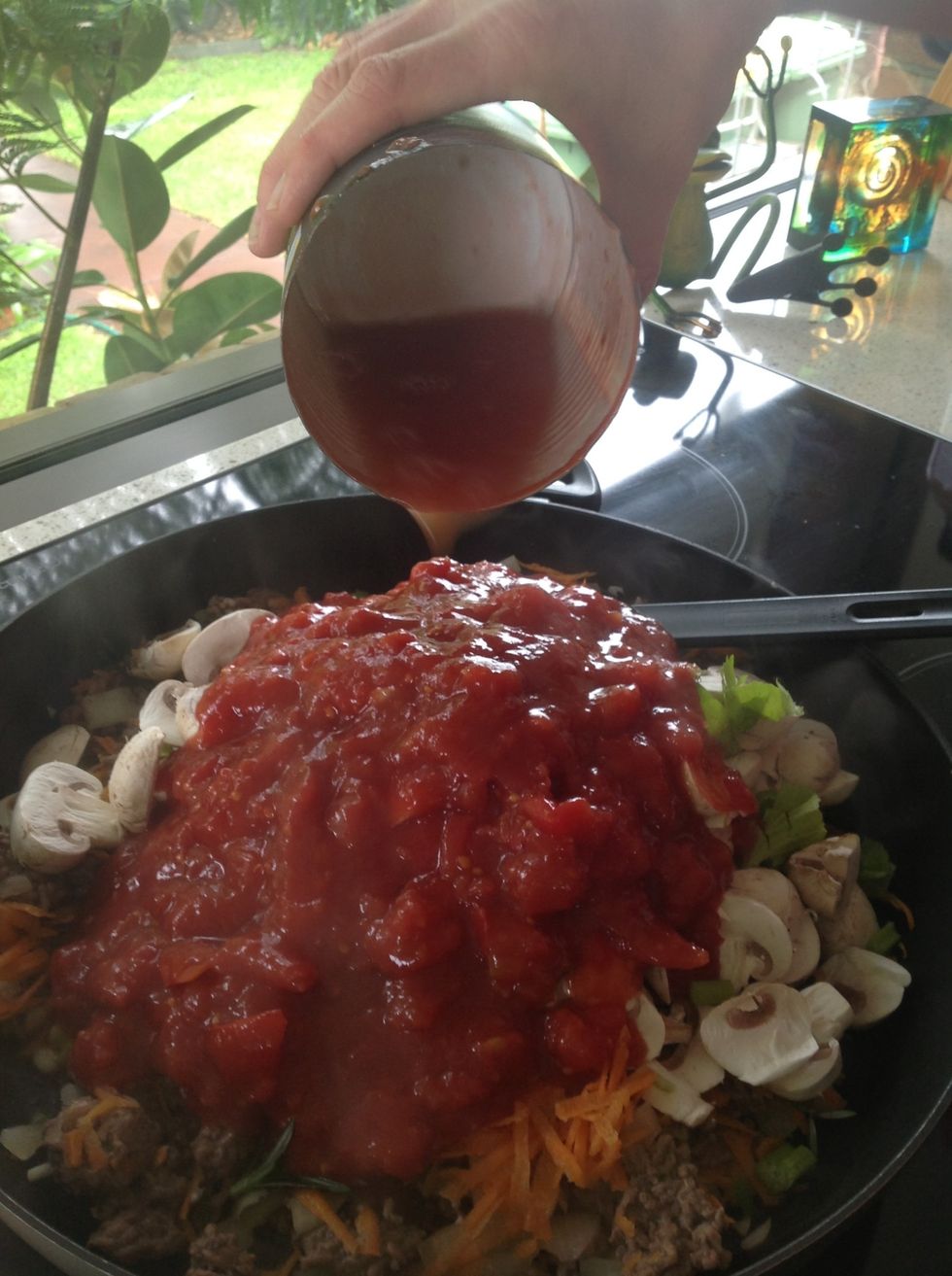 Add water into tin and swish around before tipping into pan. The water acts as a bit of a sauce for the sauce, and makes sure you don't waste any tomato
