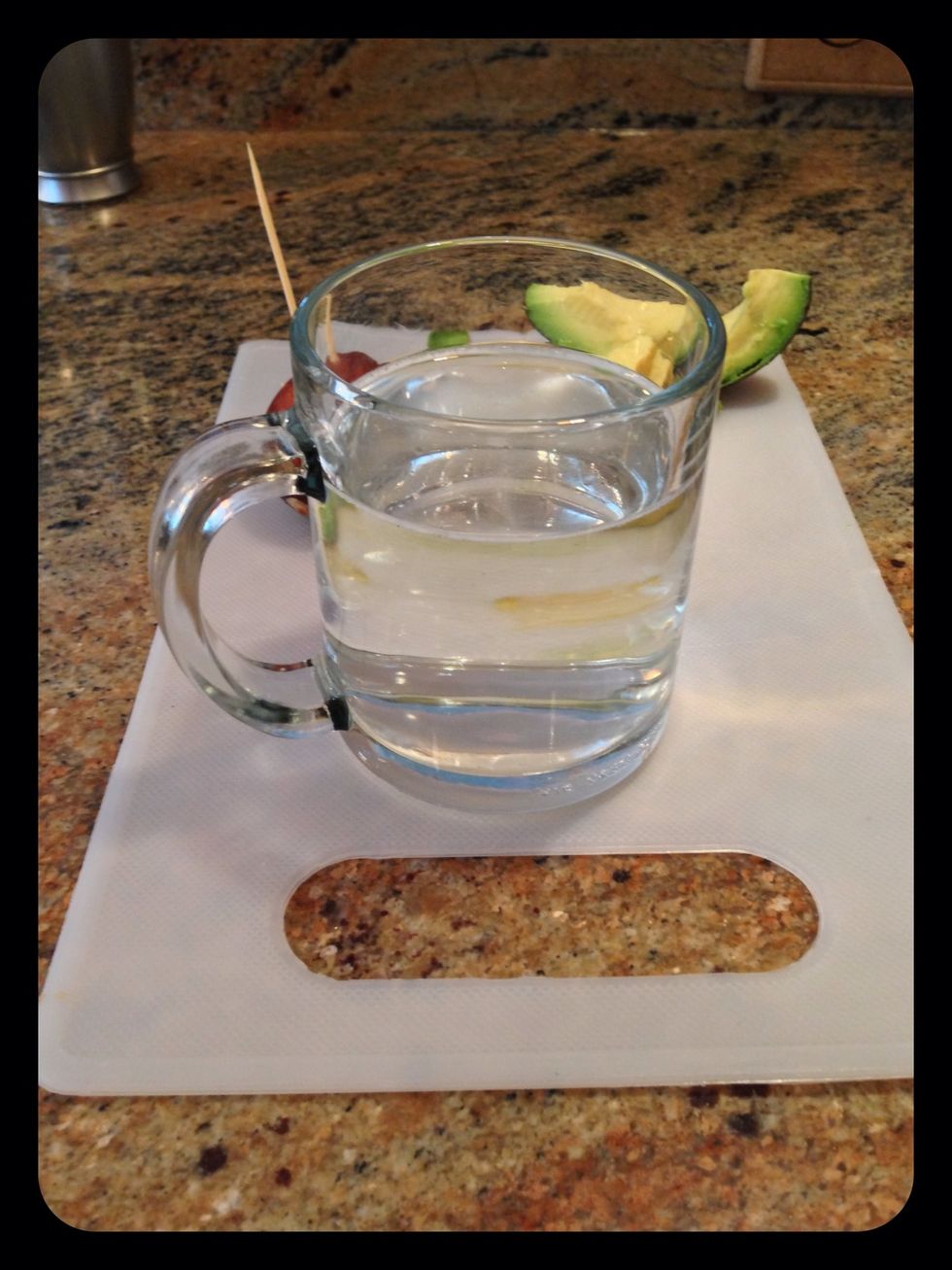 Add water to a  clear (for viewing the growth!) mug or glass.