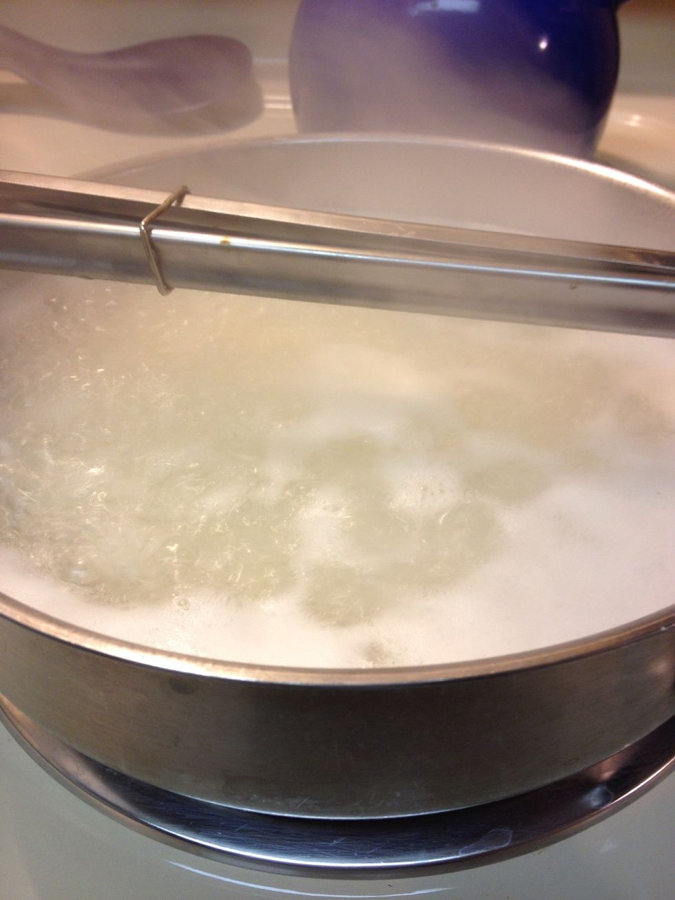 Add water to an inch above the rice. Add 1 tbsp salt to water and bring to a slow boil and cook for 8-10 minutes. I'm using a saut\u00e9 pan  with straight sides a wide bottomed pan=more Tadiq.
