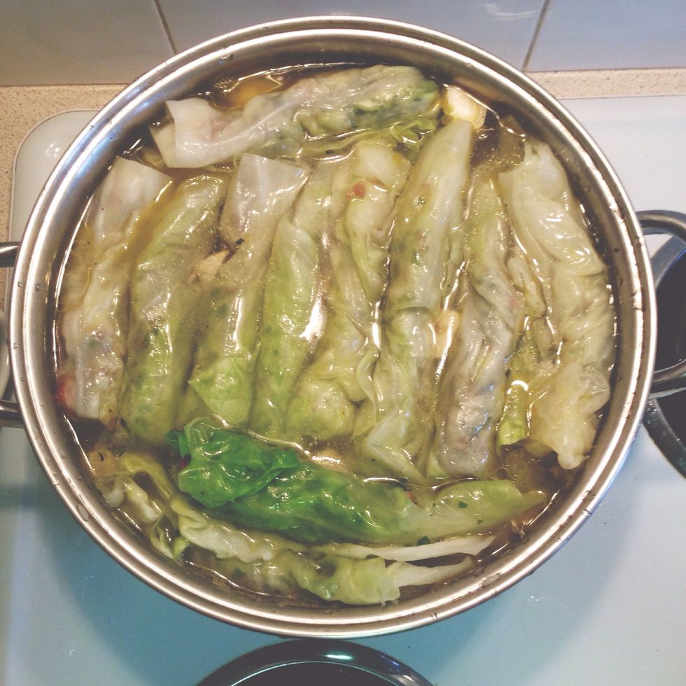Add water to barely cover top layer of cabbage and bring to a boil. Once you reach a boil, add juice of 1 lemon to pot and lower heat to maintain a gentle boil for 1 - 1.5 hours. Keep pot covered.