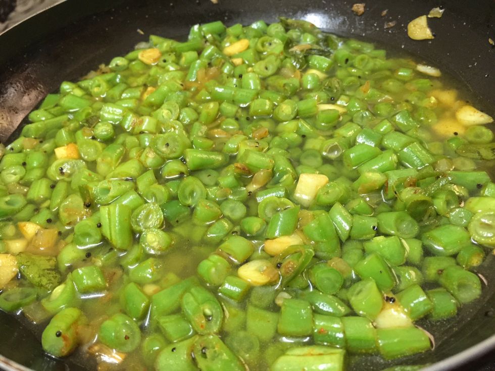 Add water to cook the beans and leave for some time