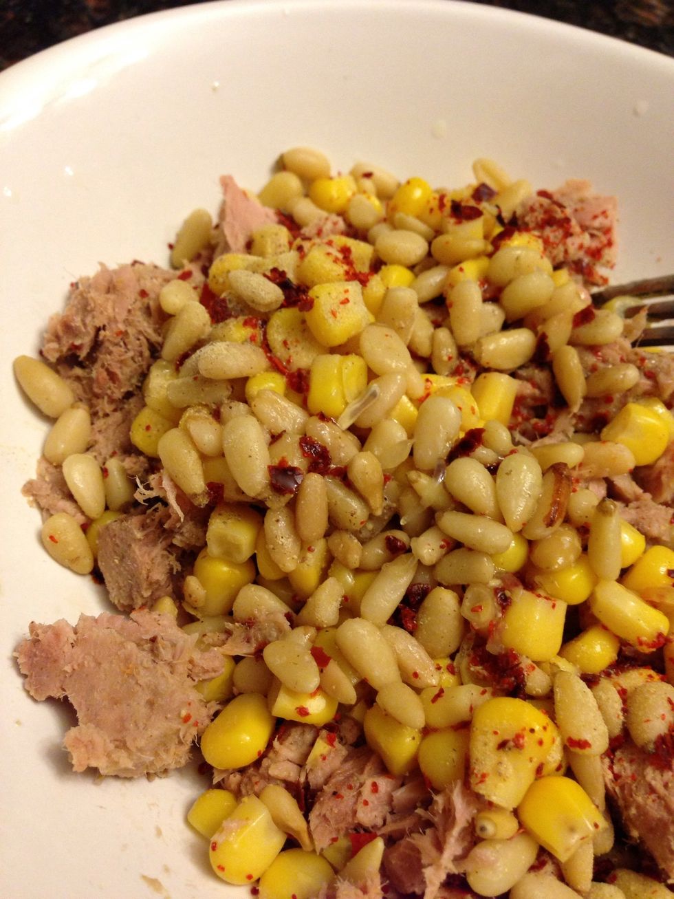 Add whatever extra ingredients you want. I added some pine nuts, chilli flakes, white pepper, and juice of half a lemon. Then mix it. The veg should be cooked now.