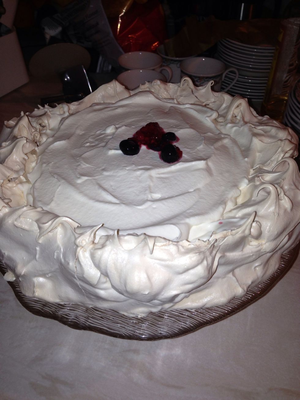 Add whipped cream to the centre of the pavlova after it has cooled.