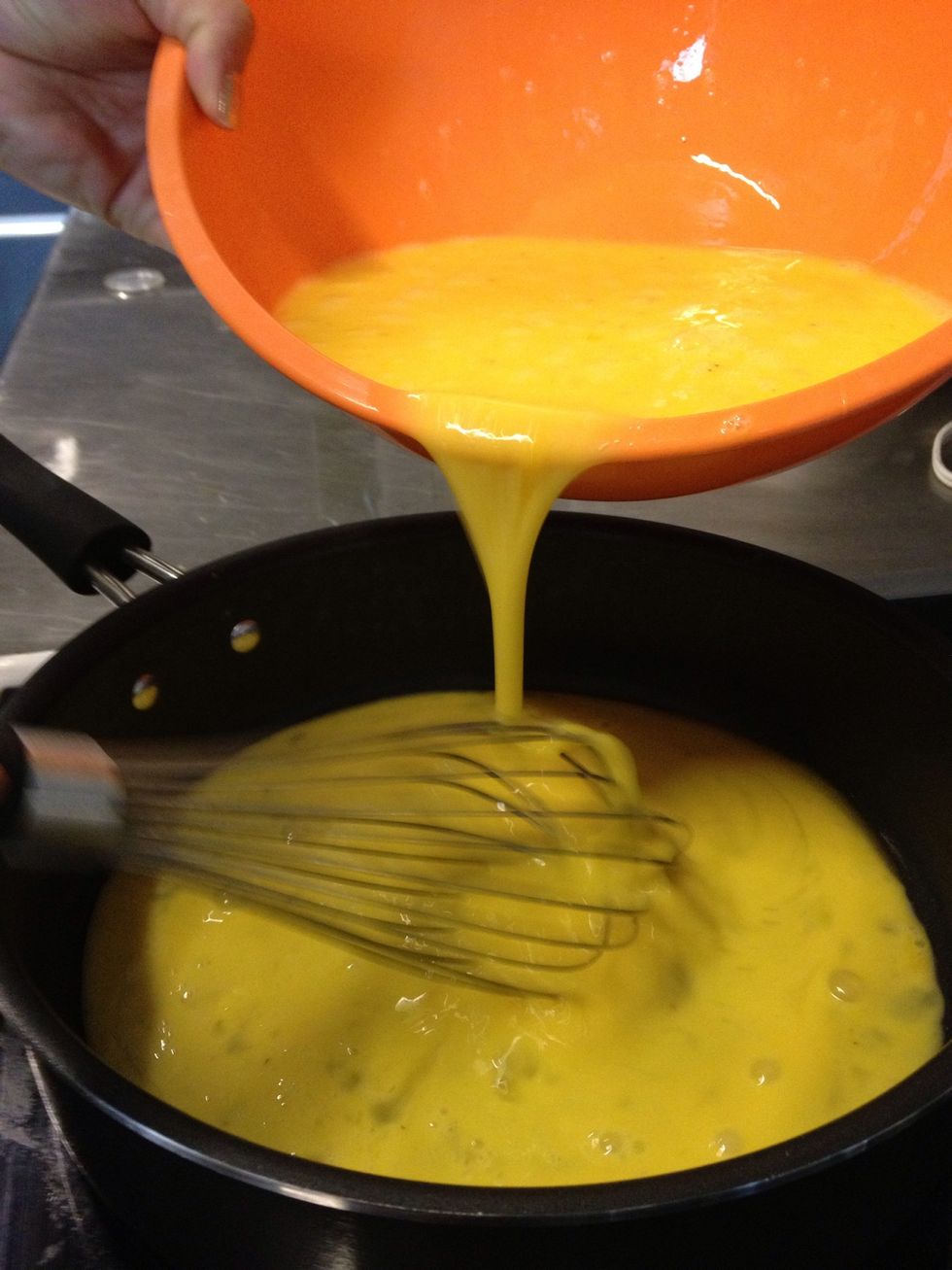 Add whisked eggs to pan once heated.