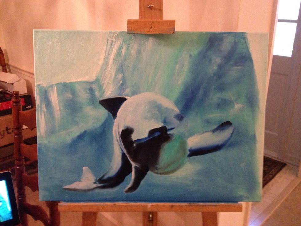 Add white and blue to the tail, then black to the flipper and body.