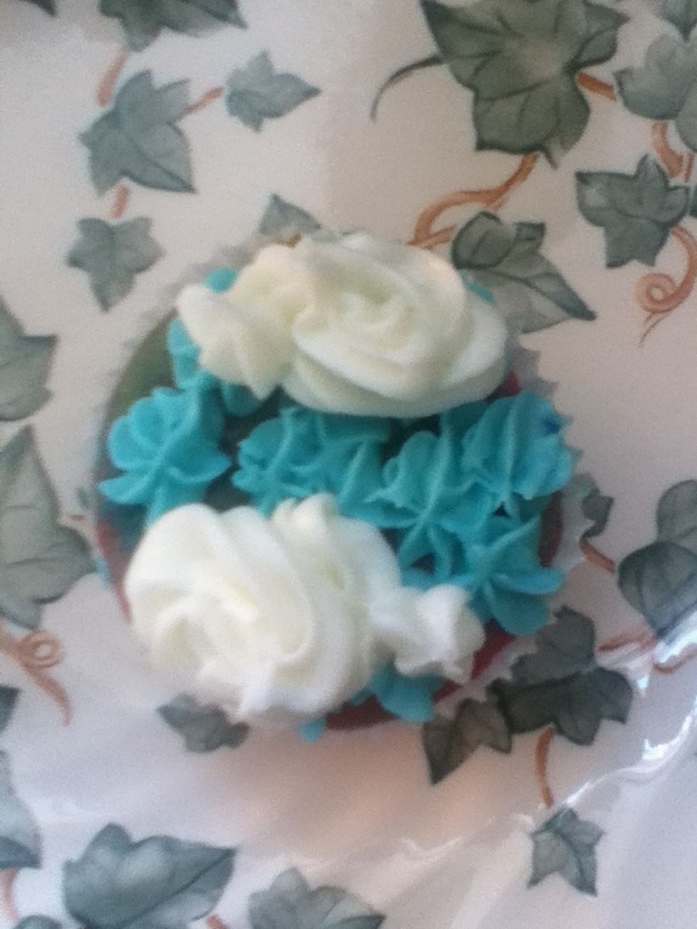 Add white butter icing as clouds