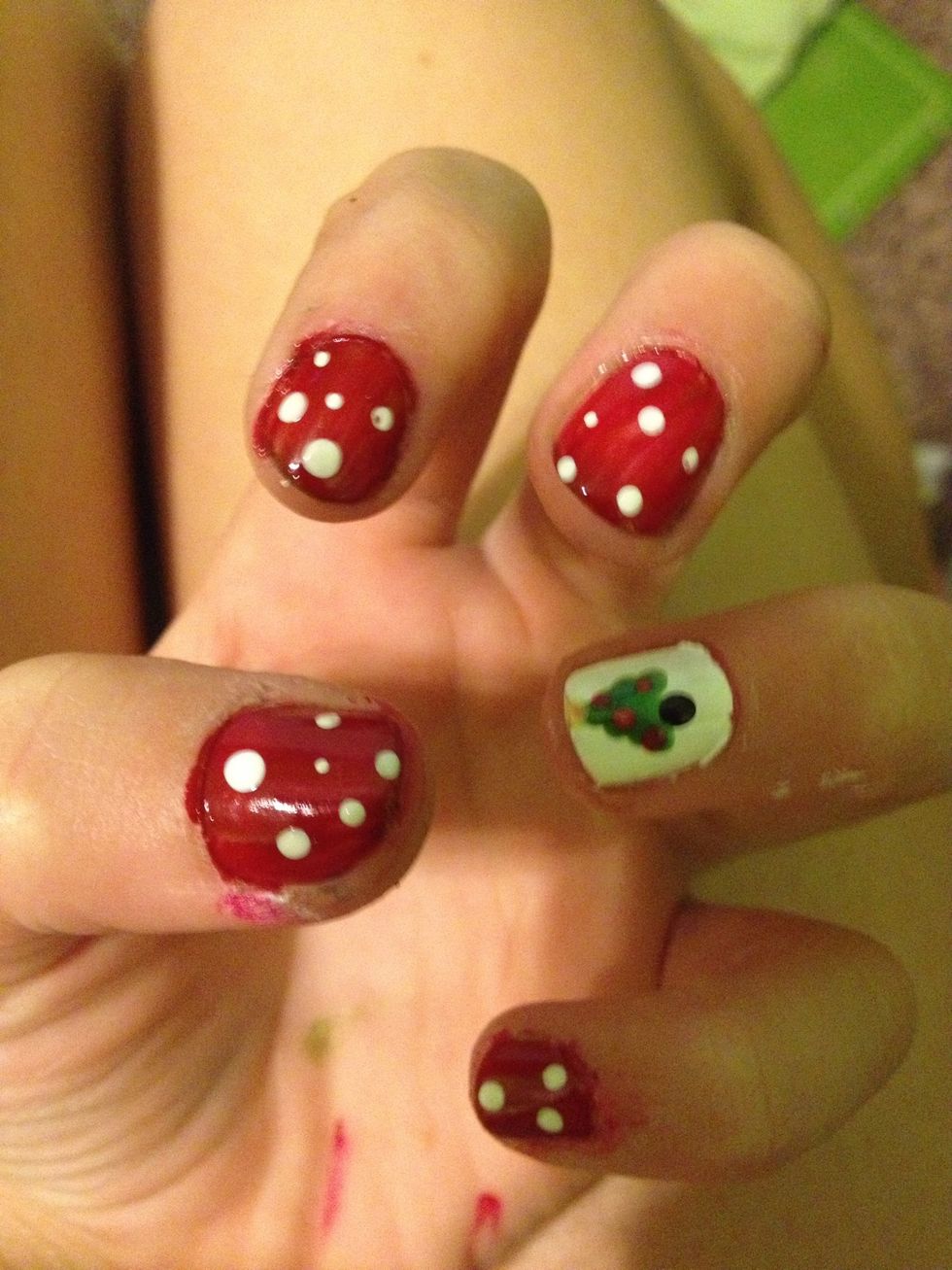 Add white dots to look like snow flakes on all the red nails