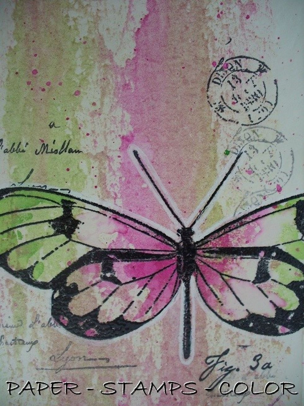 Add white highlighting to the butterfly with a white acrylic marker.