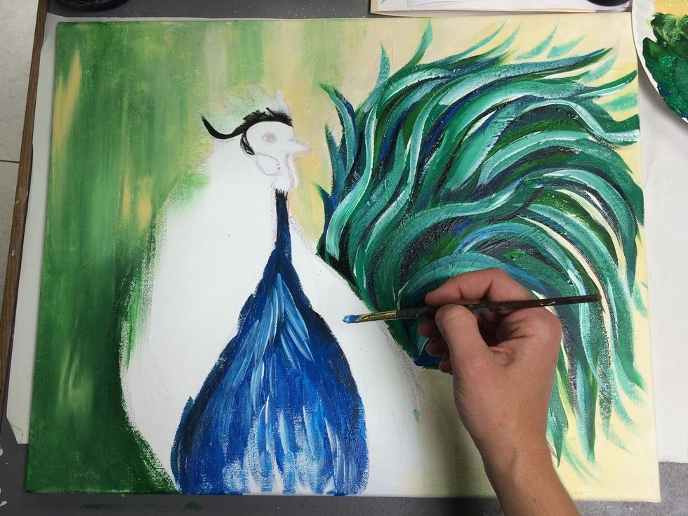 Add white short, vertical brush stokes over the blue. Allow the colors to mix a little and create a feather texture.
