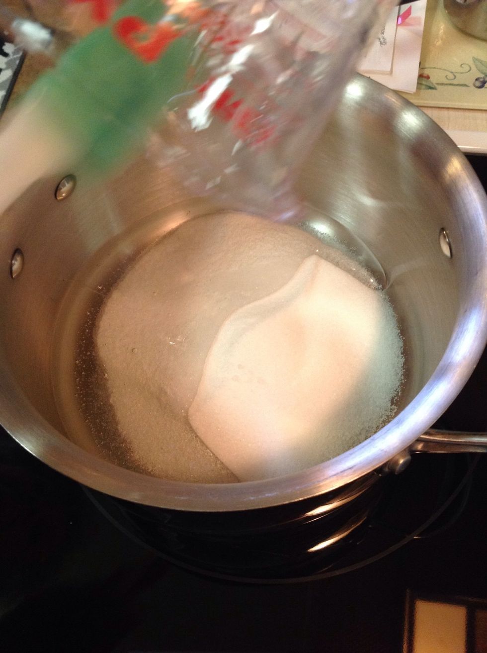 Add white syrup to sugar in pot and bring to a boil.