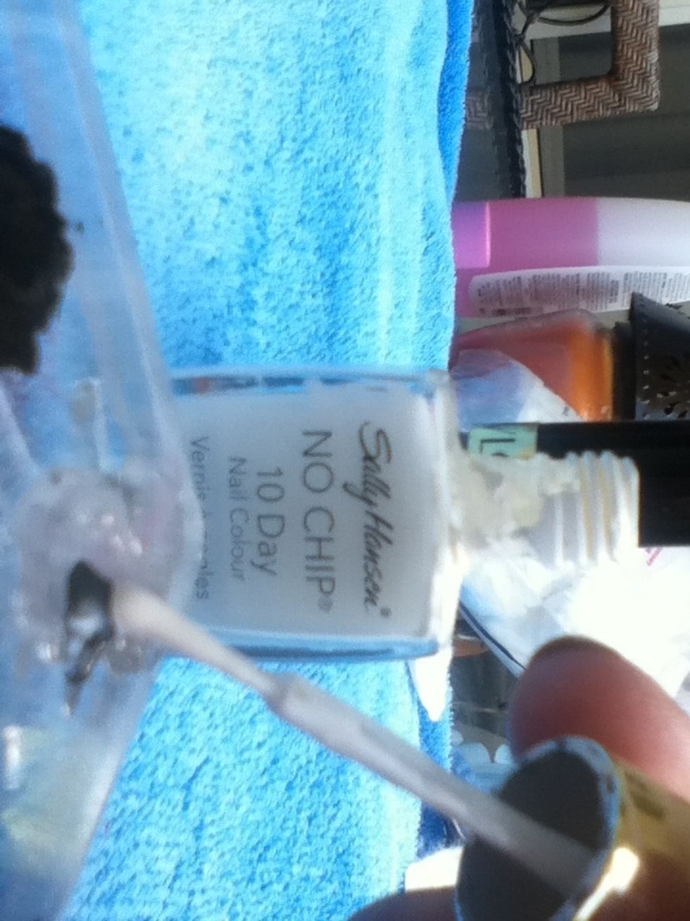 Add white to the dark grey. Helpful hint: For every 1 drop of dark grey, add two drops of white.