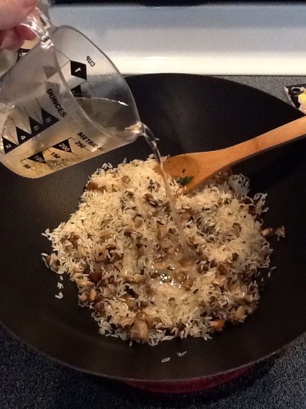 Add white wine and cook until wine is almost completely absorbed by the rice.  I love Moscato d'Asti for its sweetness.  Feel free to pour an extra glass for yourself while you cook.  :-)