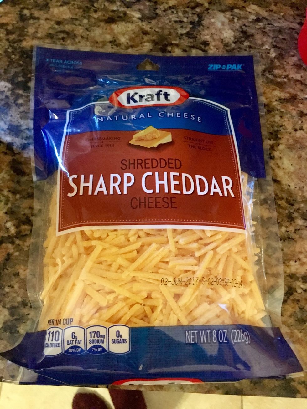 Add Whole bag of shredded sharp cheese (leave some to sprinkle on top)
