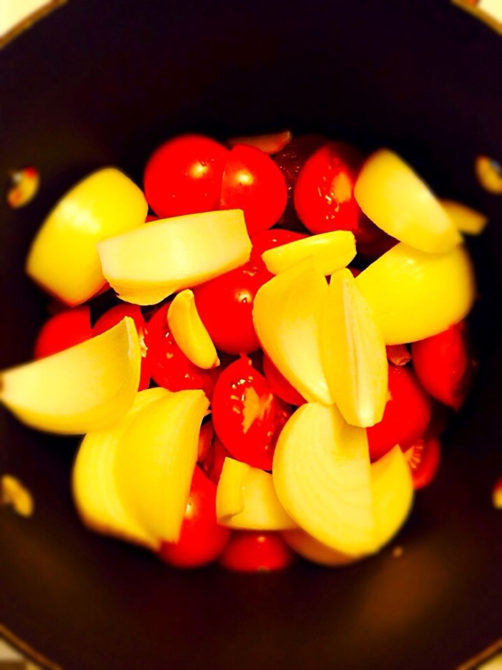 Add with tomatoes garlic and onion (no need chopping, we will process the vegetables after they cooked)