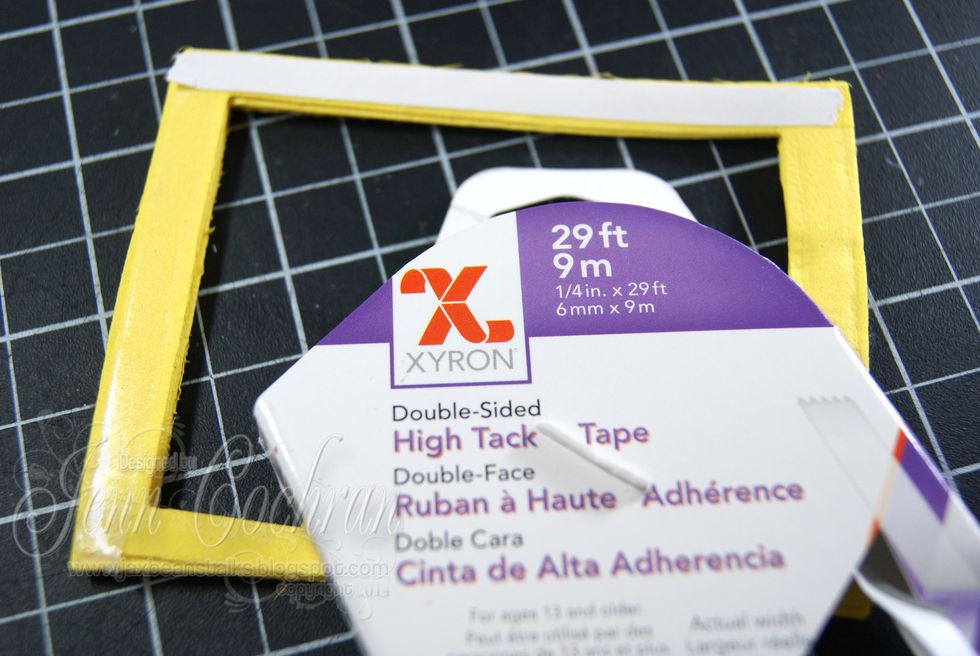Add Xyron 1/4" High Tack Tape to the front of the foam frame.