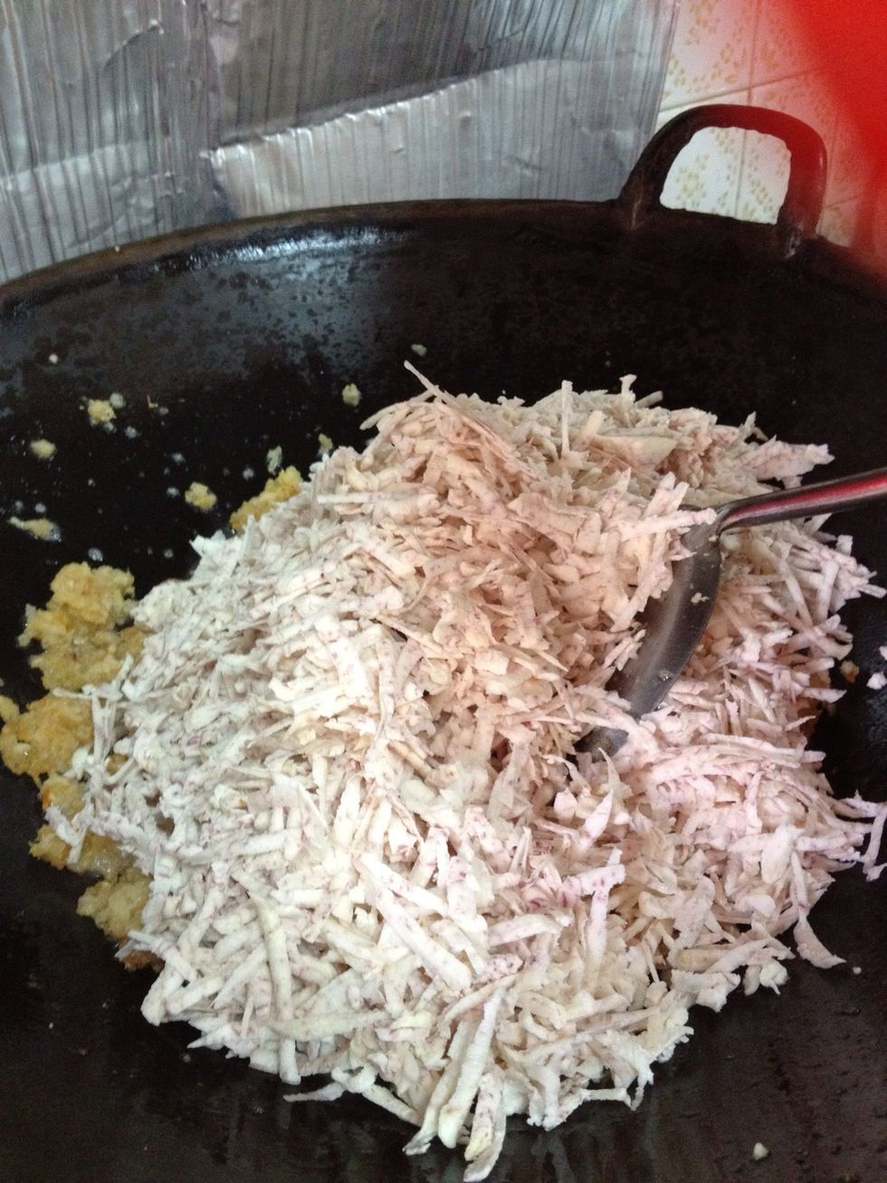 Add yam and continue to stir fry. Adjust heat accordingly while frying.