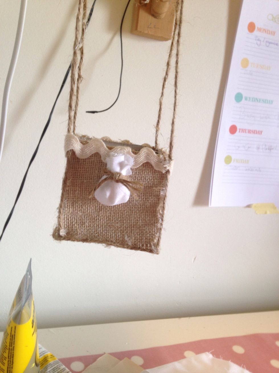 Add yarn then glue to front of carriage