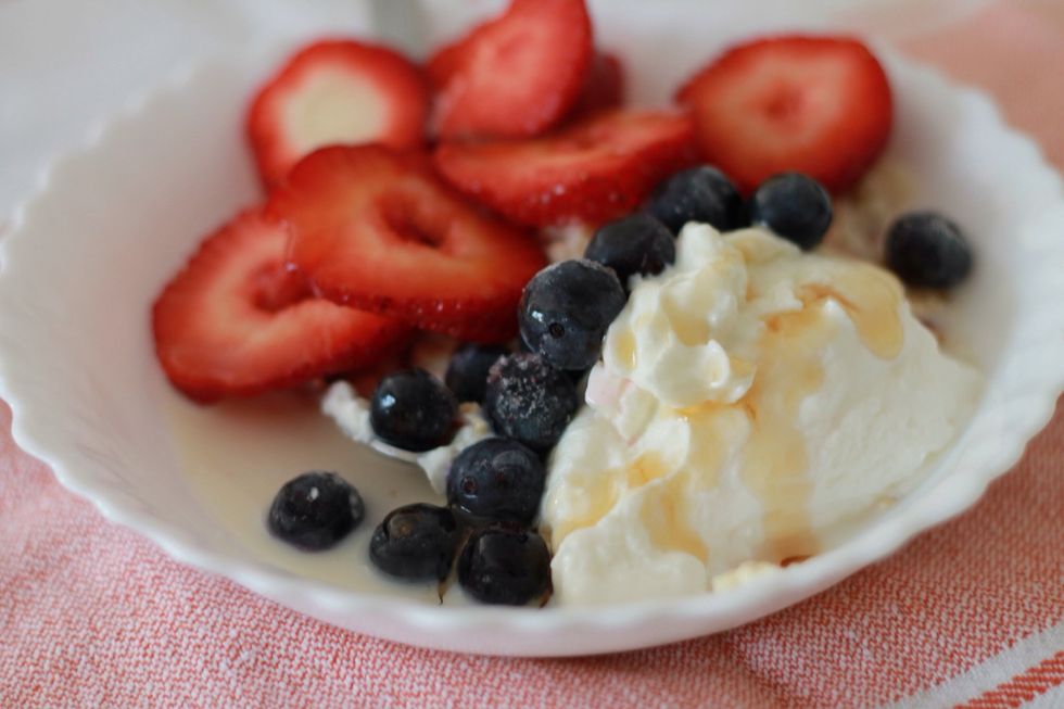 Add yogurt, berries and any other fruit you like.