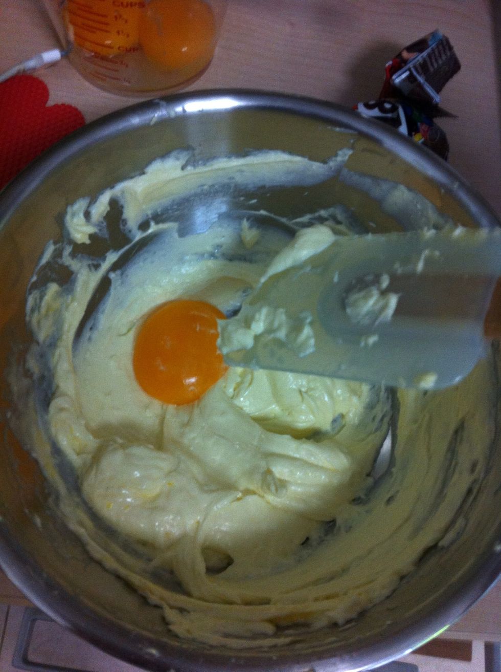 Add yolk into cheese mixture third at time. Mix well.