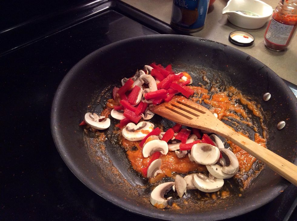 Add you red bell peppers and mushrooms. Incorporate into the curry and coconut cream.