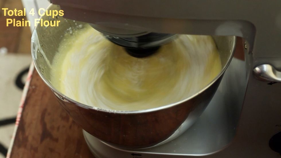 Add your 2 teaspoons of baking powder. If you want to use sugar, add 1/2 a cup. This cake dough has no sugar. It's all in the custard filling.