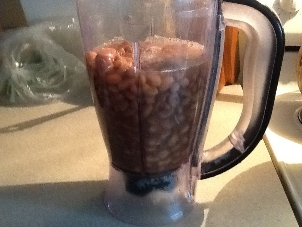 Add your beans in the blender with a little water