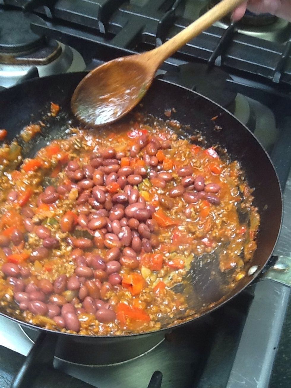 Add your beans in when the chilli has become thick and the beef stock is mostly gone.