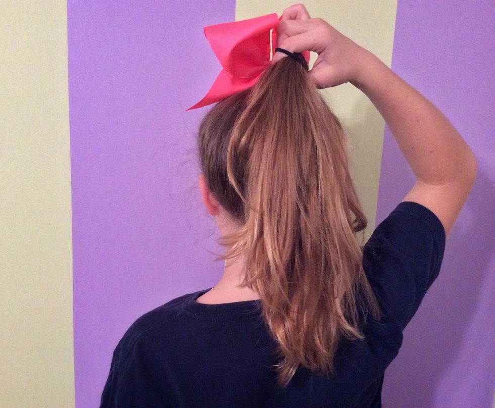 Add your bow to your ponytail.