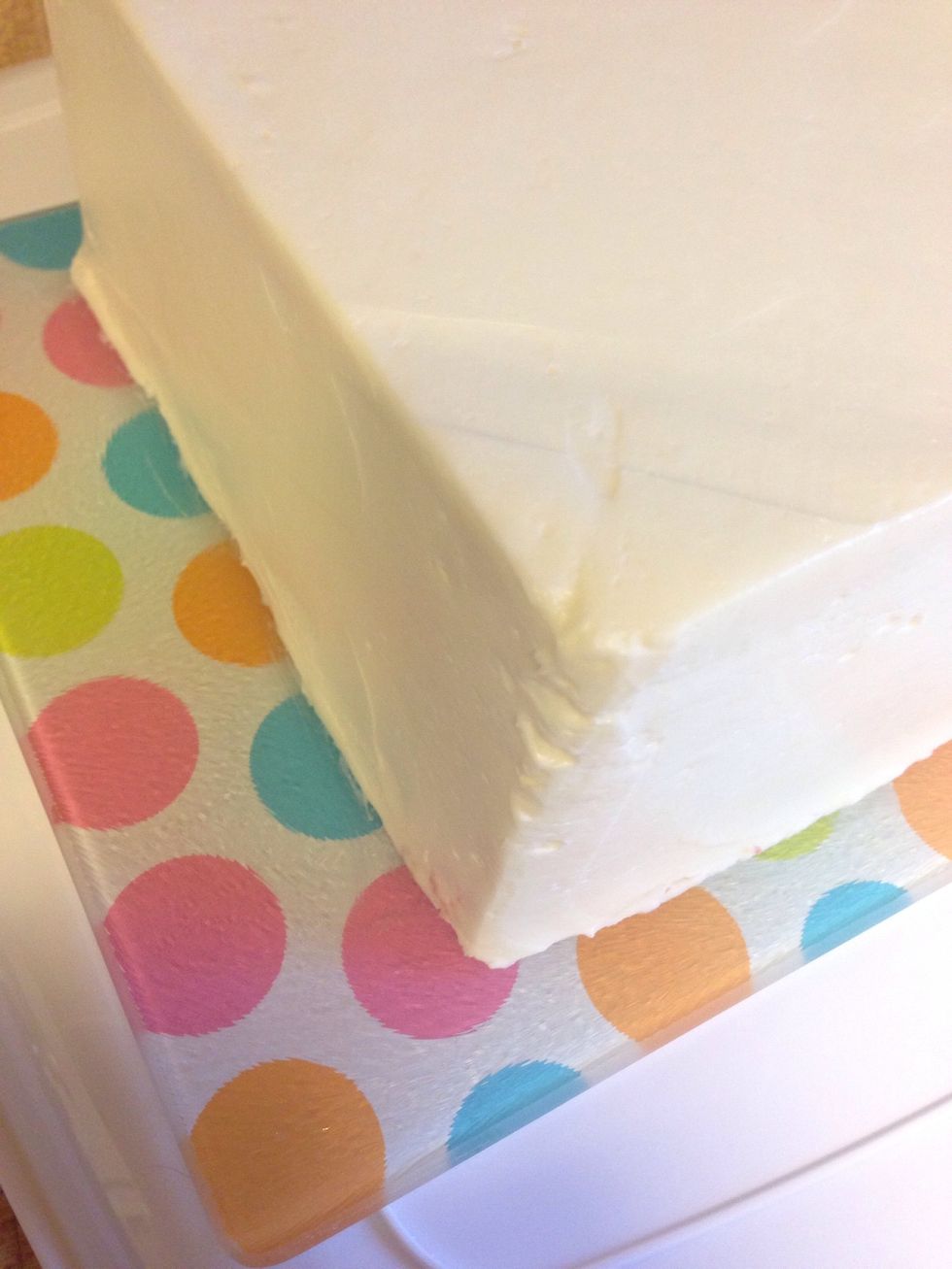 Add your cake to the serving dish. Don't worry about the bottom edges, those will be covered.