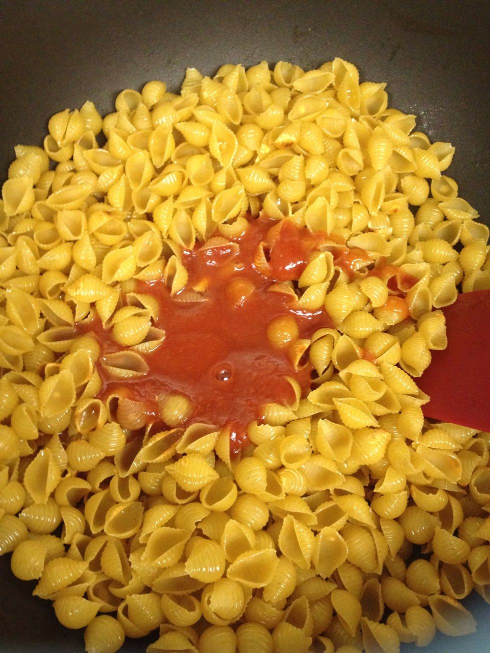 Add your can of tomato sauce