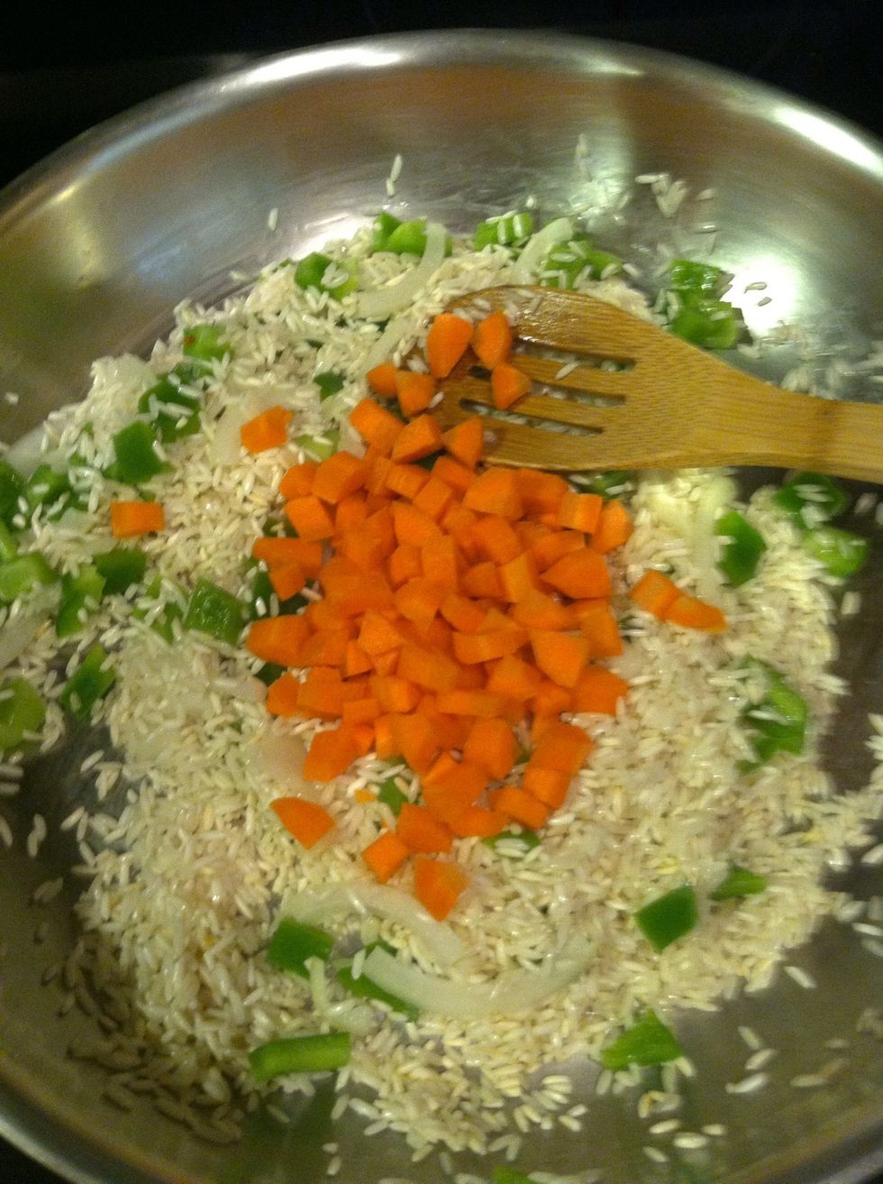 Add your carrots, and saut\u00e9 another minute