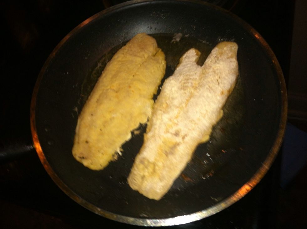 Add your catfish to your pan. Fry it until the coating feels crispy. The fish will curl up it's completely normal