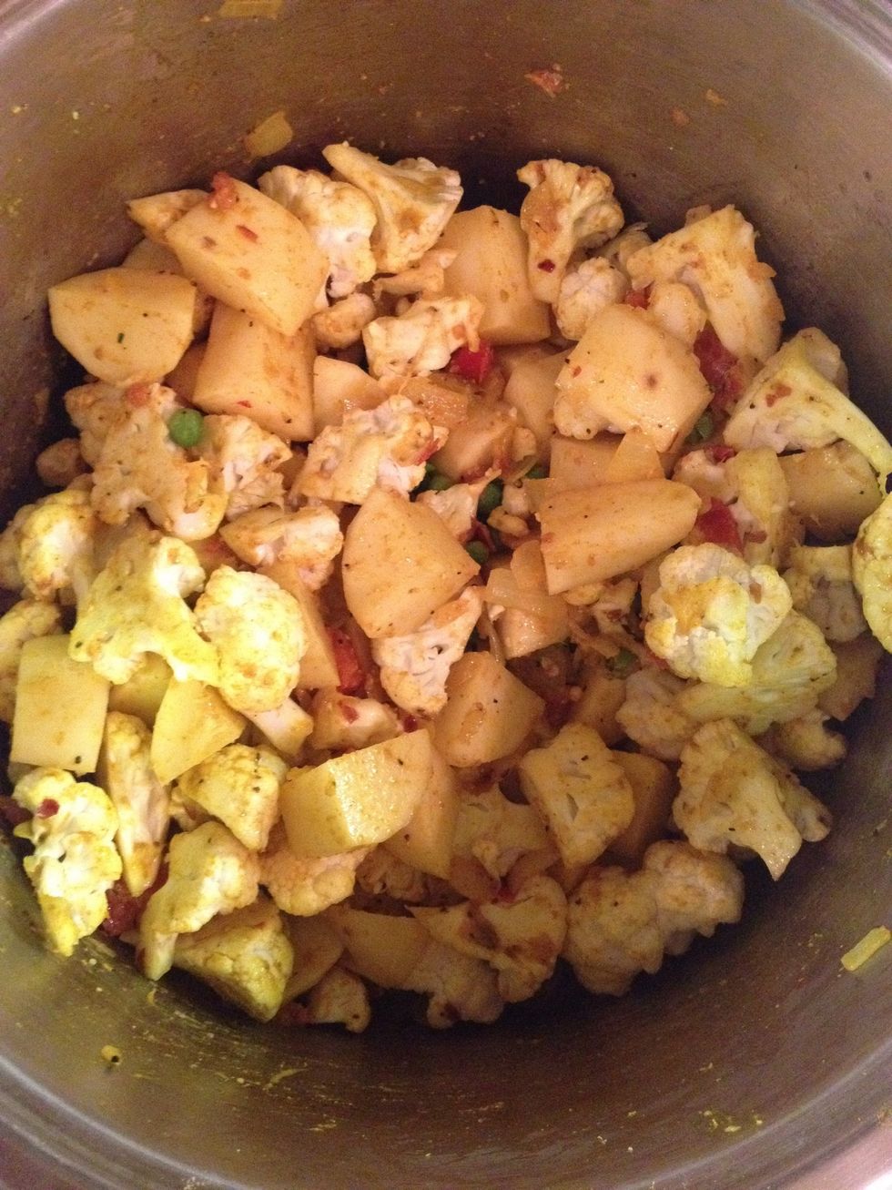 Add your cauliflower and potatoes..