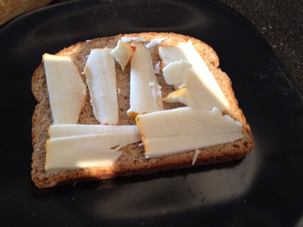 Add your cheese to one slice of bread.