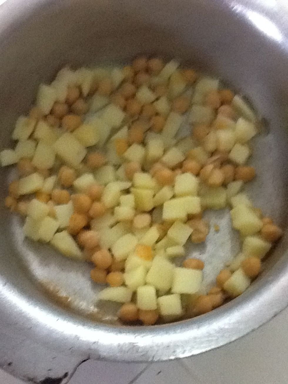 Add your chickpeas and potatoes to the yoghurt mixture