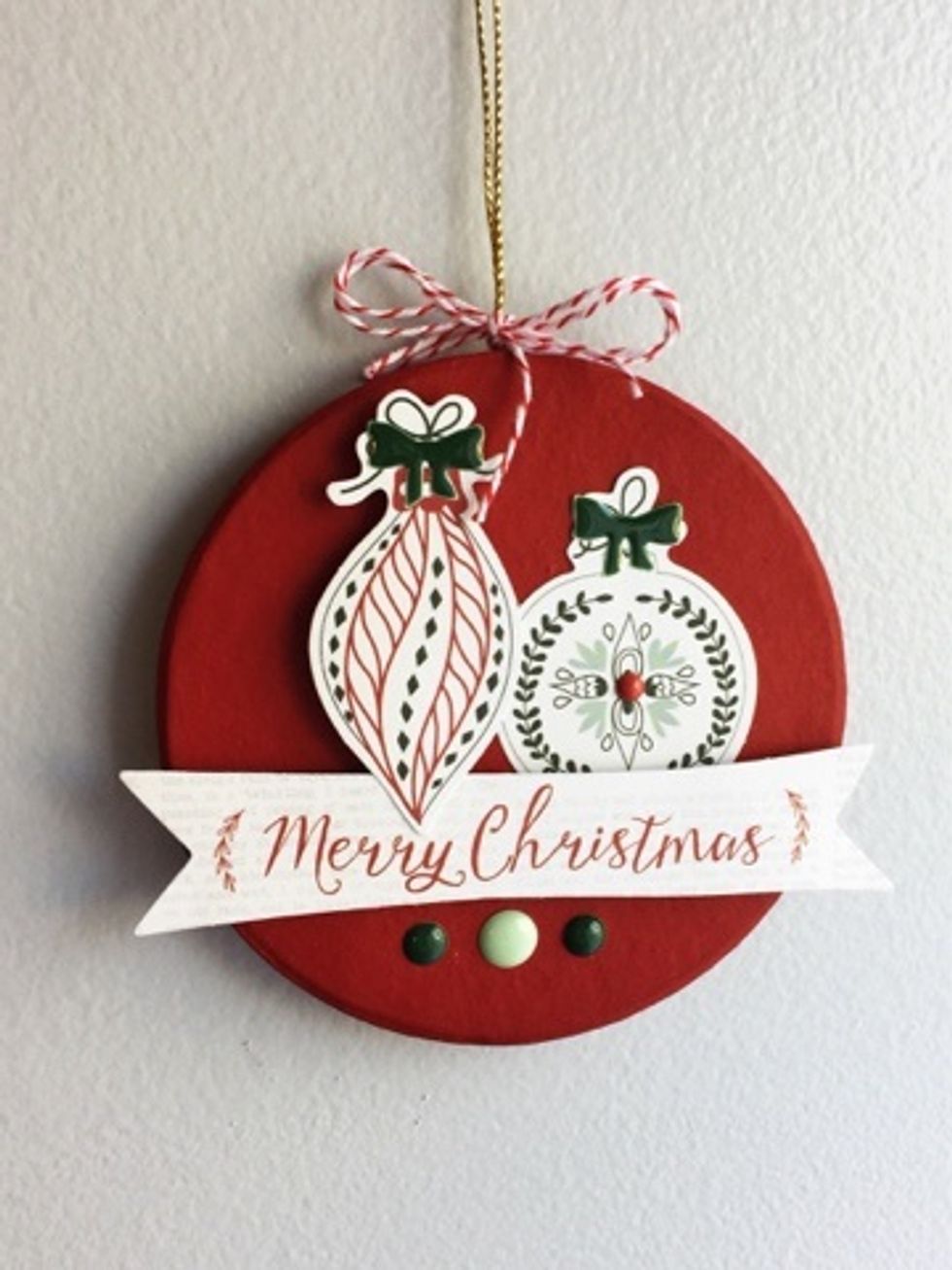 Add your choice of chipboard, enamels dots and buttons.