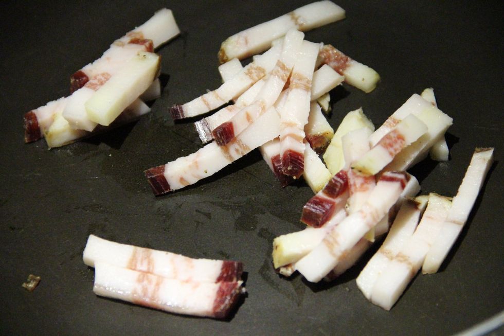 Add your chopped bacon to the pan and sizzle