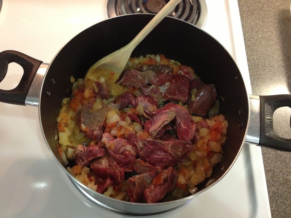 Add your chopped beef, salt, pepper and chicken bouillon to taste and let your meat cook all around.