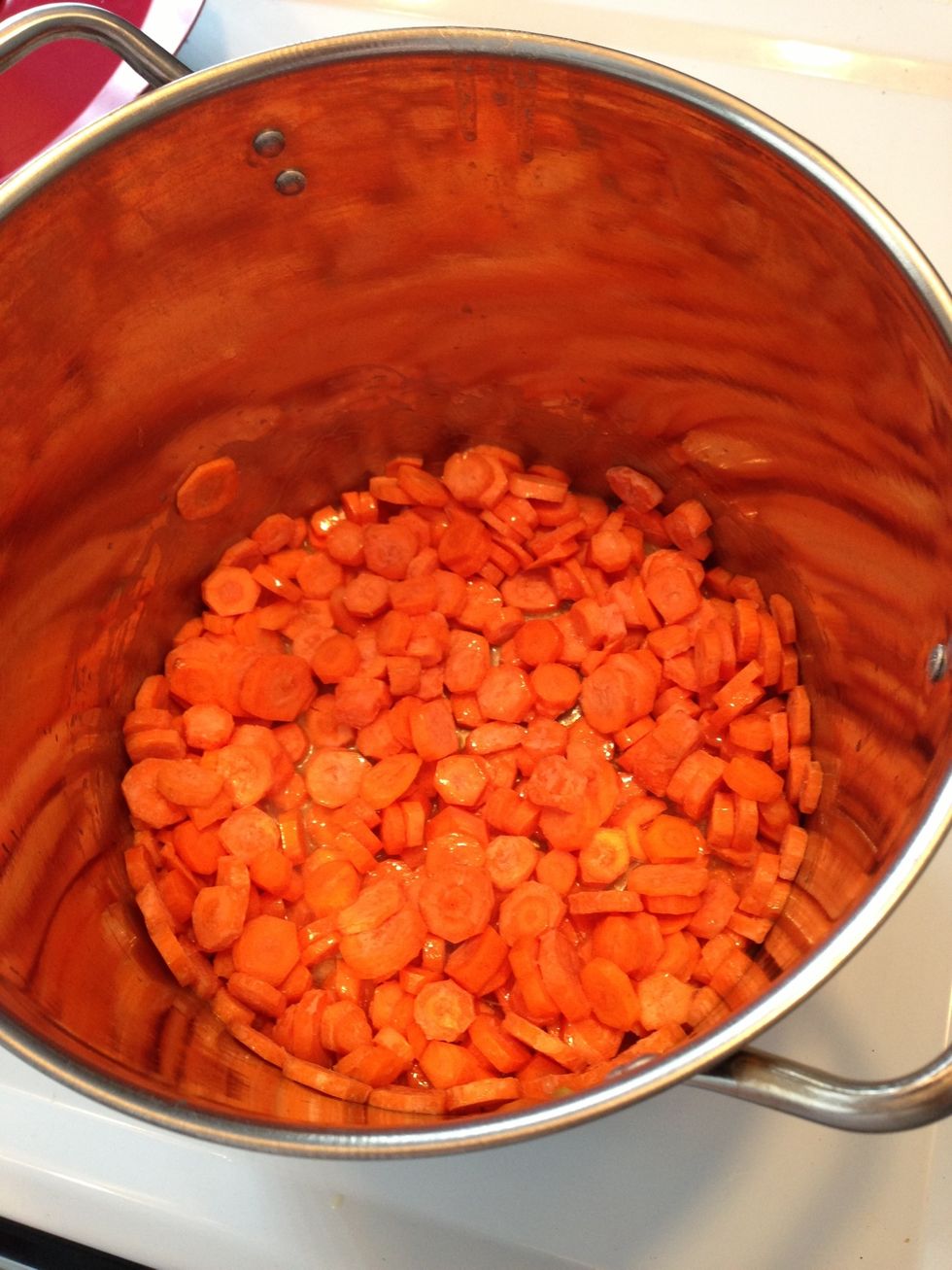 Add your chopped carrots and stir. They take longer so they go First.