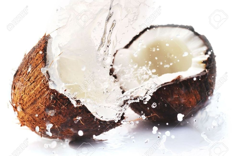 Add your coconut water- no I'm not climbing palm trees, I use store bought coconut water- I just liked this picture-