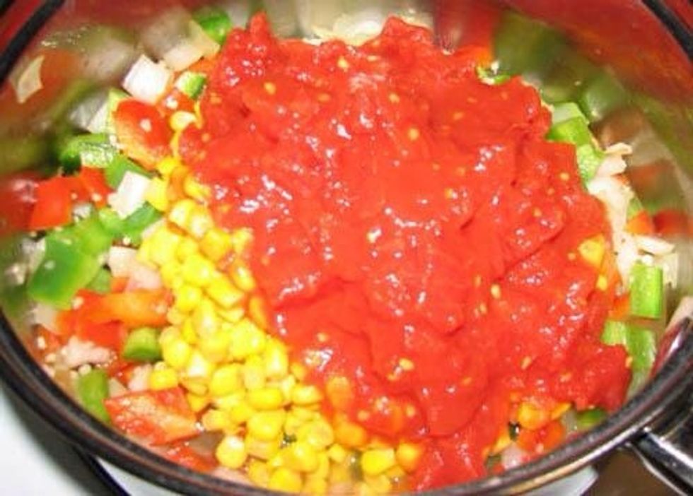 Add your corn, beans and tomatoes. Don't bother to drain first, just dump it all in.