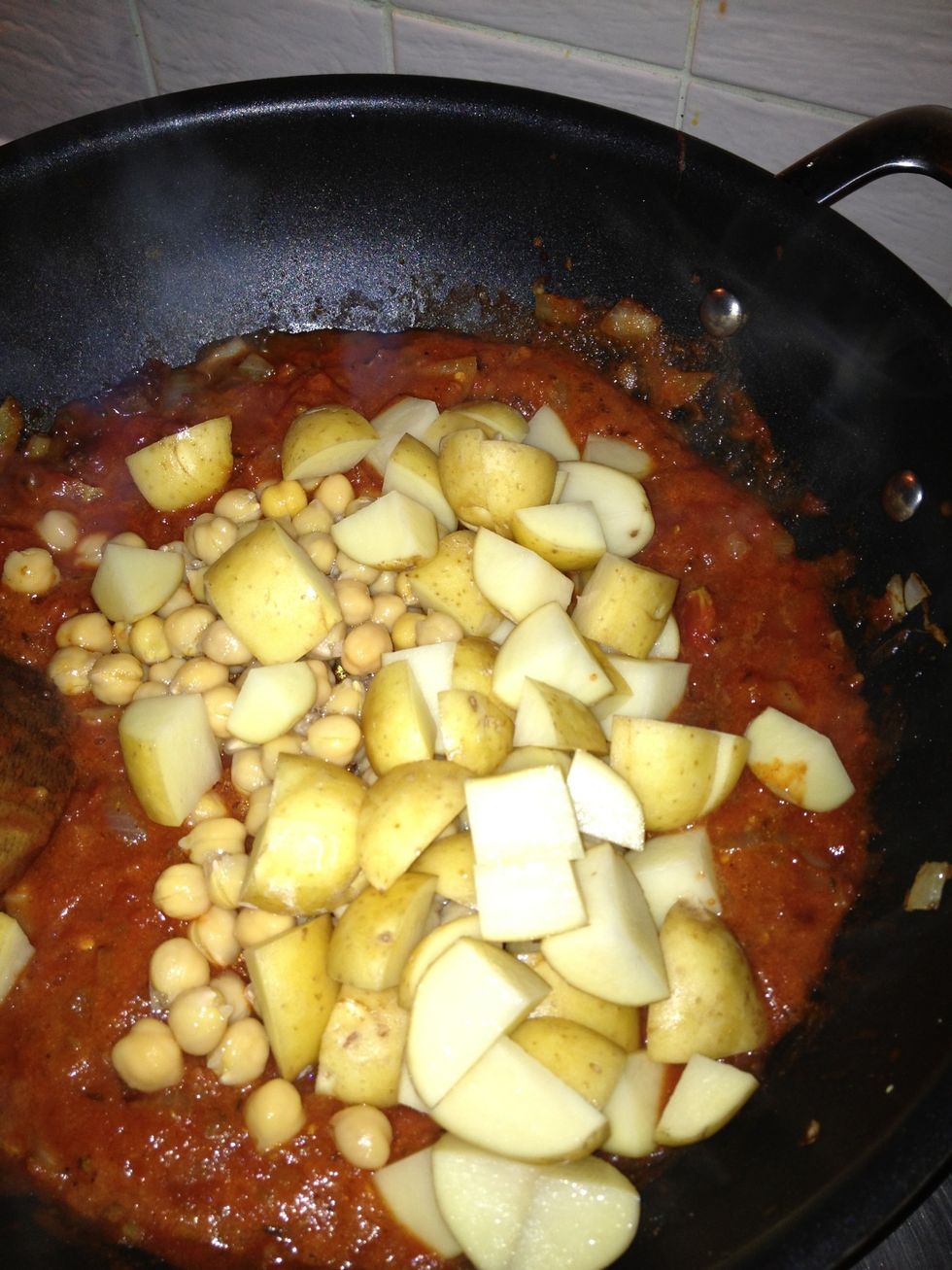 Add your cubed potatoes and chickpeas.