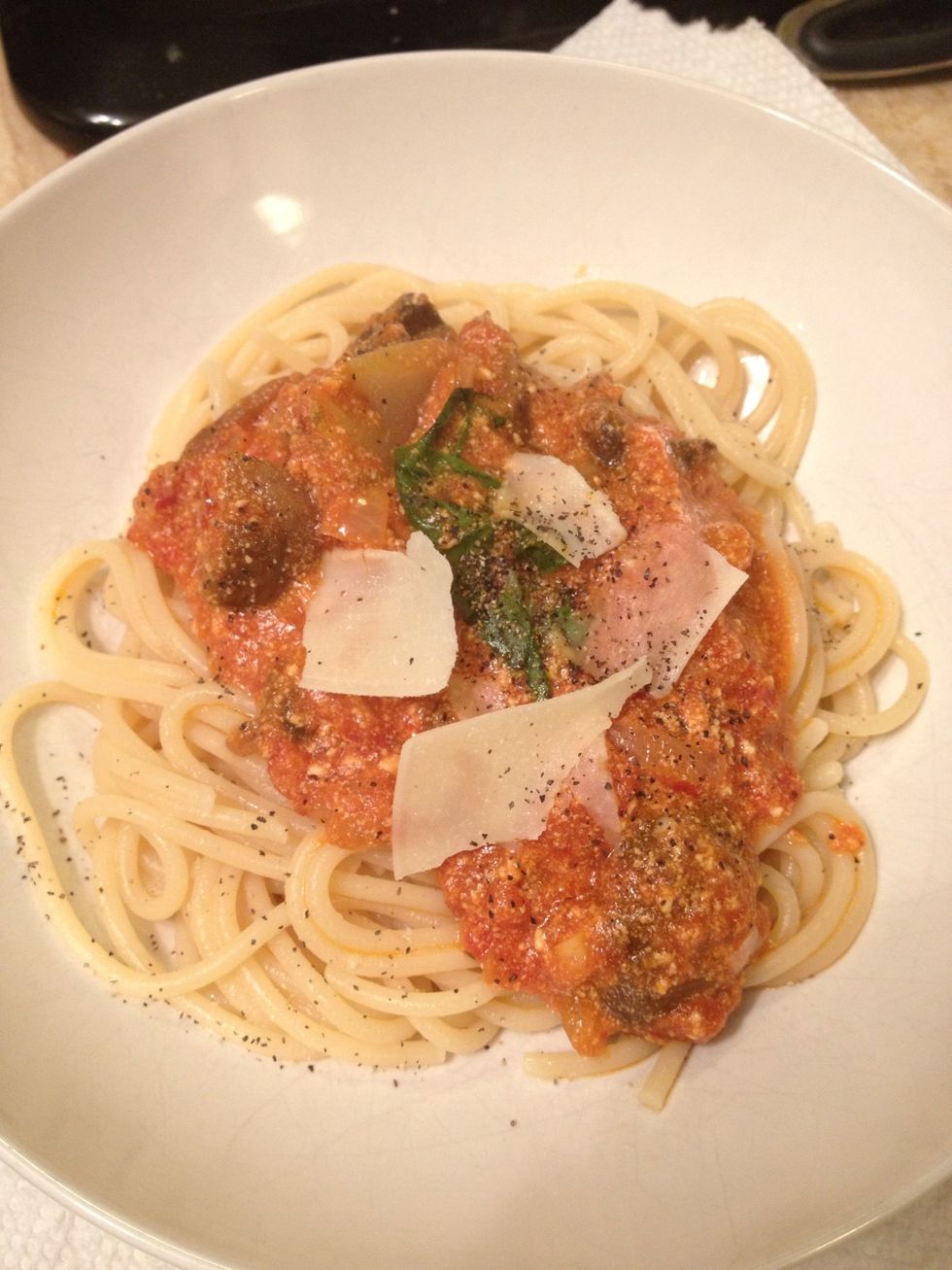 Add your delicious sauce, shaved Parmesan, and some black pepper.