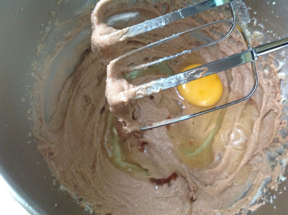Add your eggs one at a time (your eggs should be at room temp. If it isn't drop them in a bowl of warm water and allow to sit for 5 to 10 mins)