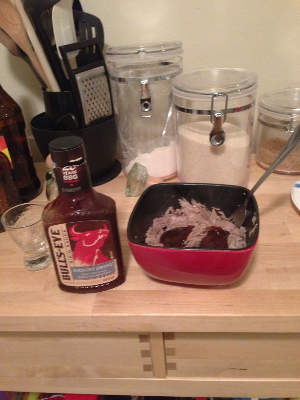 Add your favorite or homemade BBQ sauce. Generally around 4-5 oz to 1 lb of meat.