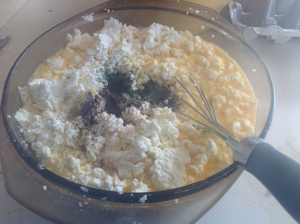 Add your feta, Parmesan, ricotta, pepper, and dried dill to your egg in the large bowl.