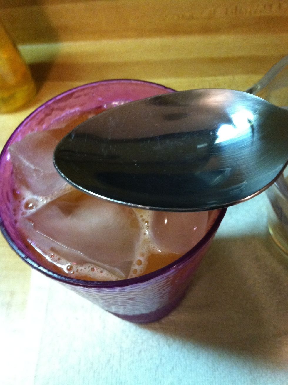 Add your flavor syrup keeping in mind its mostly sugar dissolved in water. So if you normally use 3 tsp sugar, you'll want to add 3 tsp of syrup.