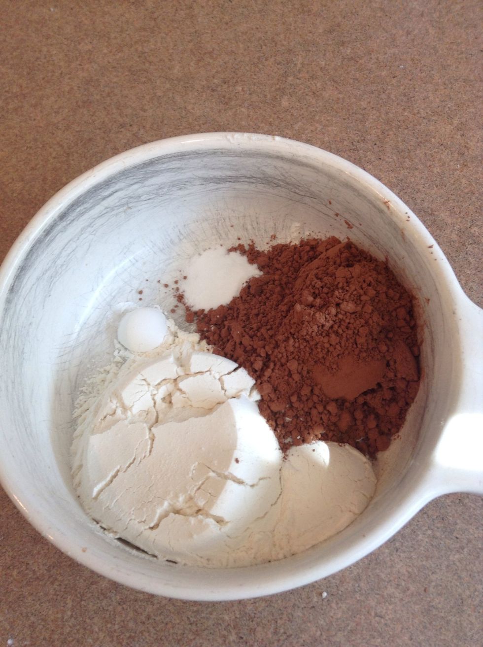 Add your flour, cocoa powder, baking powder, and baking soda to a bowl.